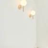 Nuura Miira wall, brass/opal- Vegglampe